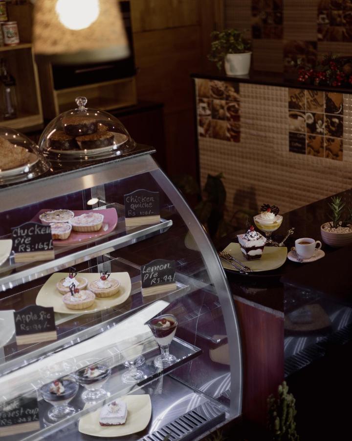 The Panoramic Getaway Hotel Munnar Exterior photo A pastry display case