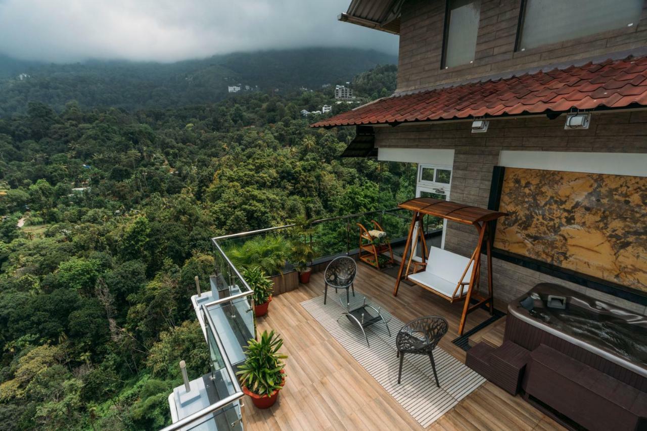The Panoramic Getaway Hotel Munnar Exterior photo A view from the balcony of a house in Kerala, India
